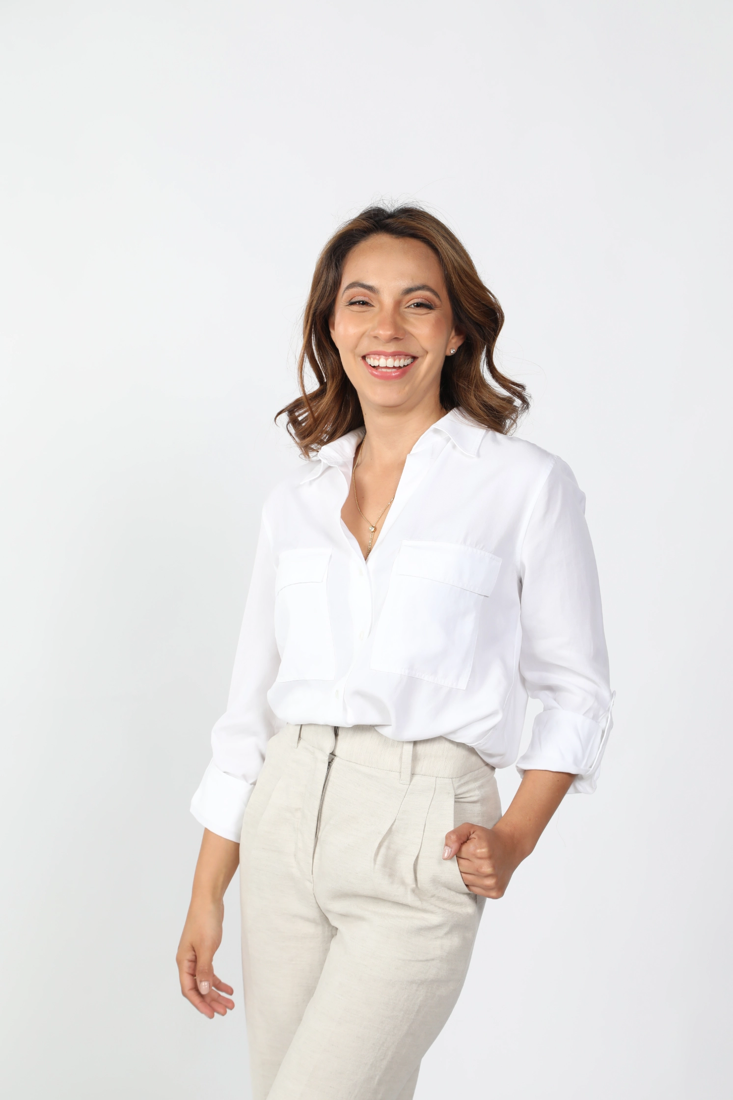 Person in white shirt with contemplative pose