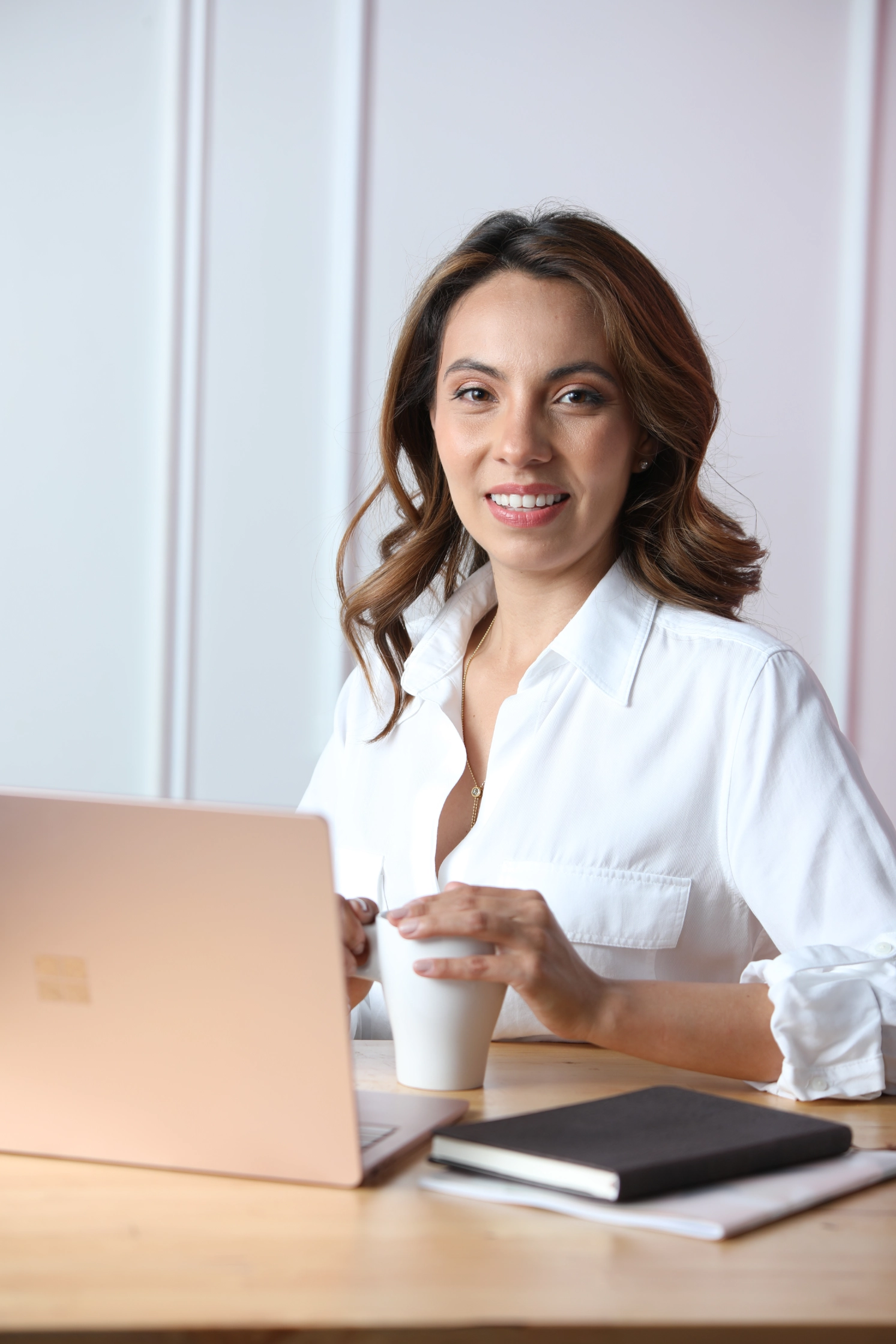 Person in white shirt sitting casually